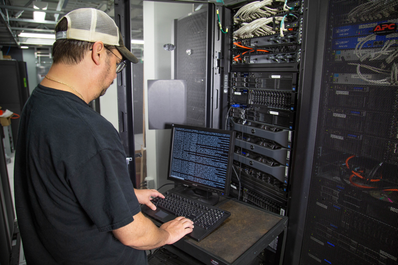 technician monitoring network infrastructure